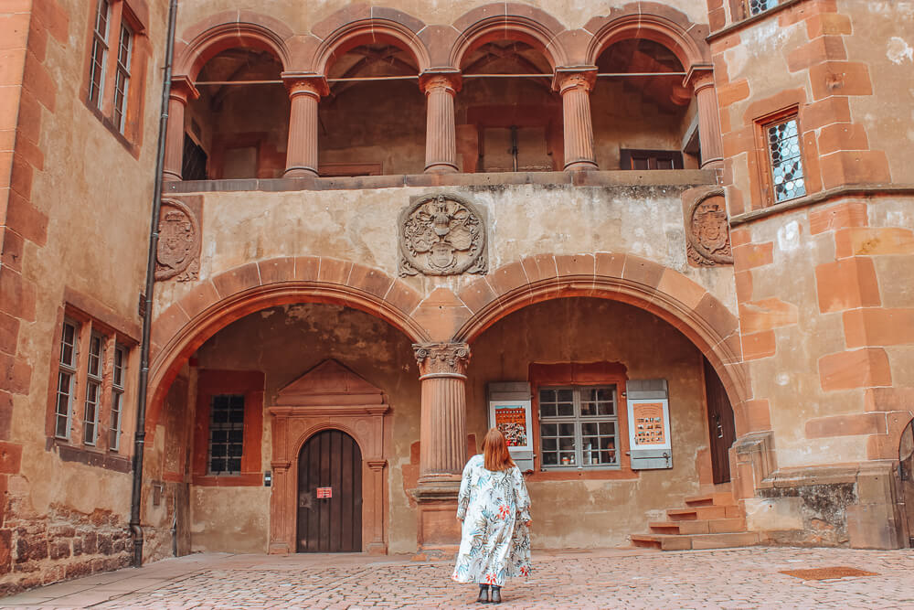 Woman looking up at Heidelberg Castle