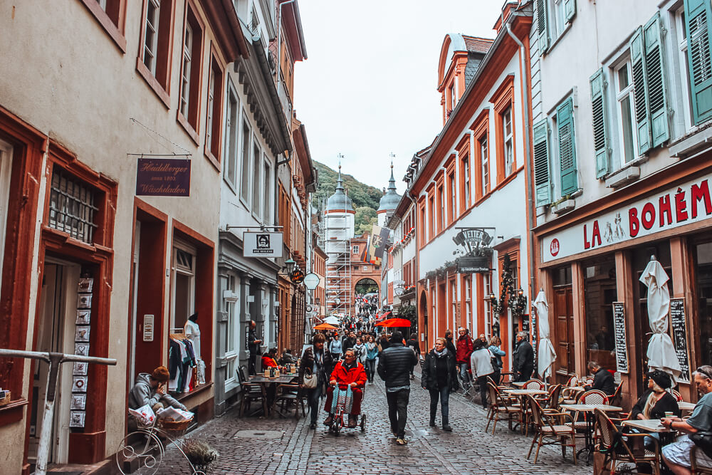 Street filled with people in the old town of Heidelberg Germany