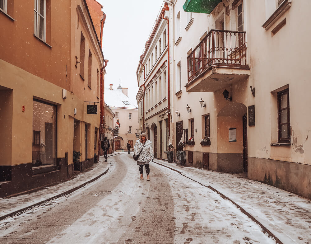 Woman walking the snowy streets in Vilnius