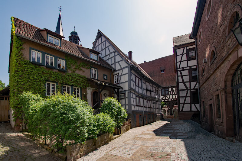 Michelstadt’s charming alleys with blooming flowers and medieval houses.