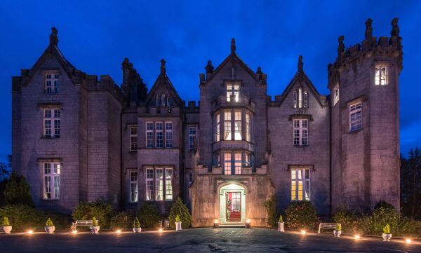 Exterior of Kinnitty Castle in Offaly at night, a haunted hotel in Ireland