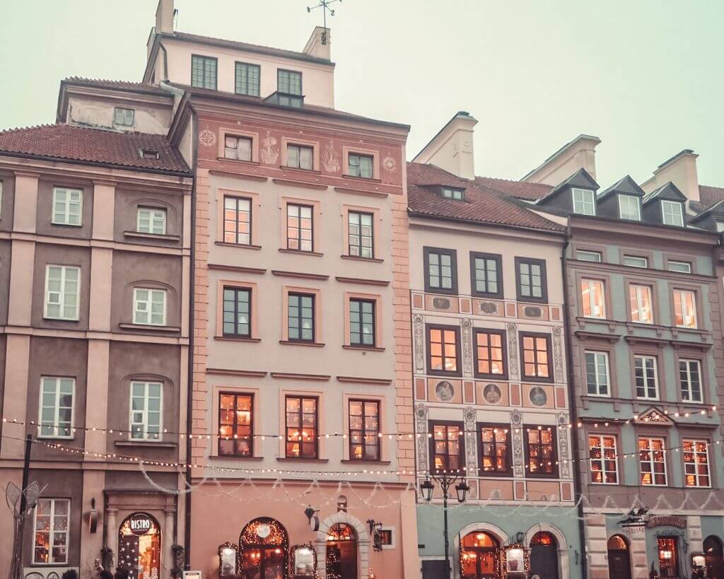 Pretty Pastel Buildings of Warsaw Old Town with Christmas Lights