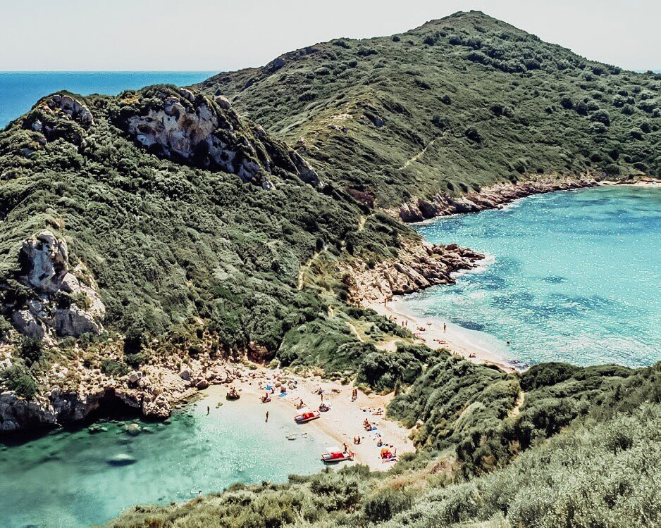 Image of a bay in Corfu. A guide on the best travel insurance for digital nomads and how to save yourself money making sure that you are protected while travelling. 