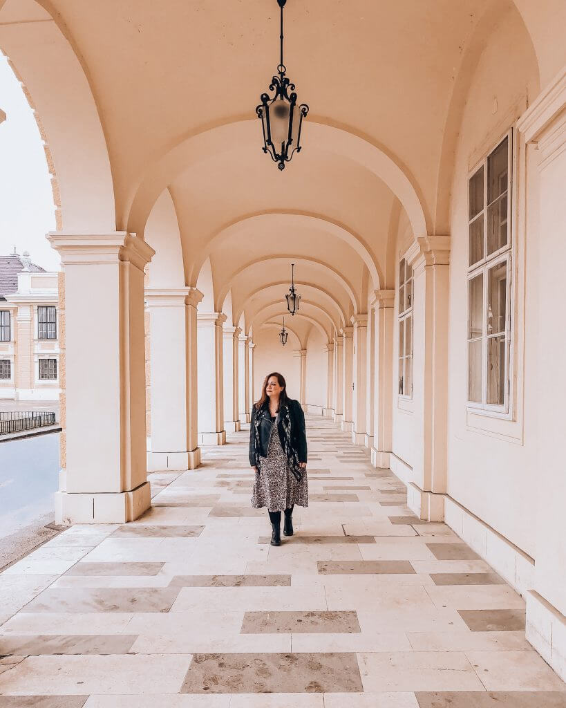 A woman walks under beautiful arches in Vienna, Austria, on a 3-day trip.