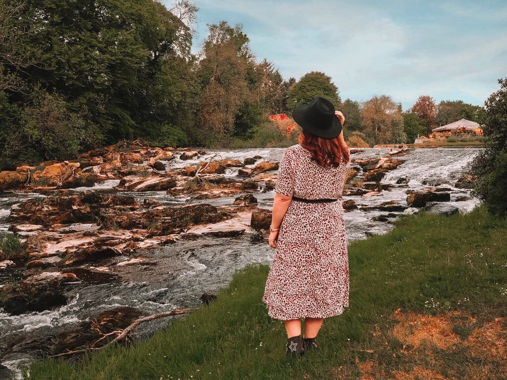 Girl looking at the River Maine in Northern Ireland