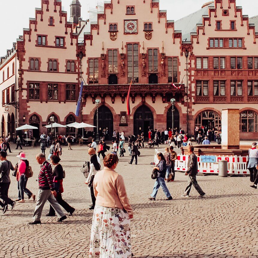 Woman walking around Romerberg in Frankfurt Old Town