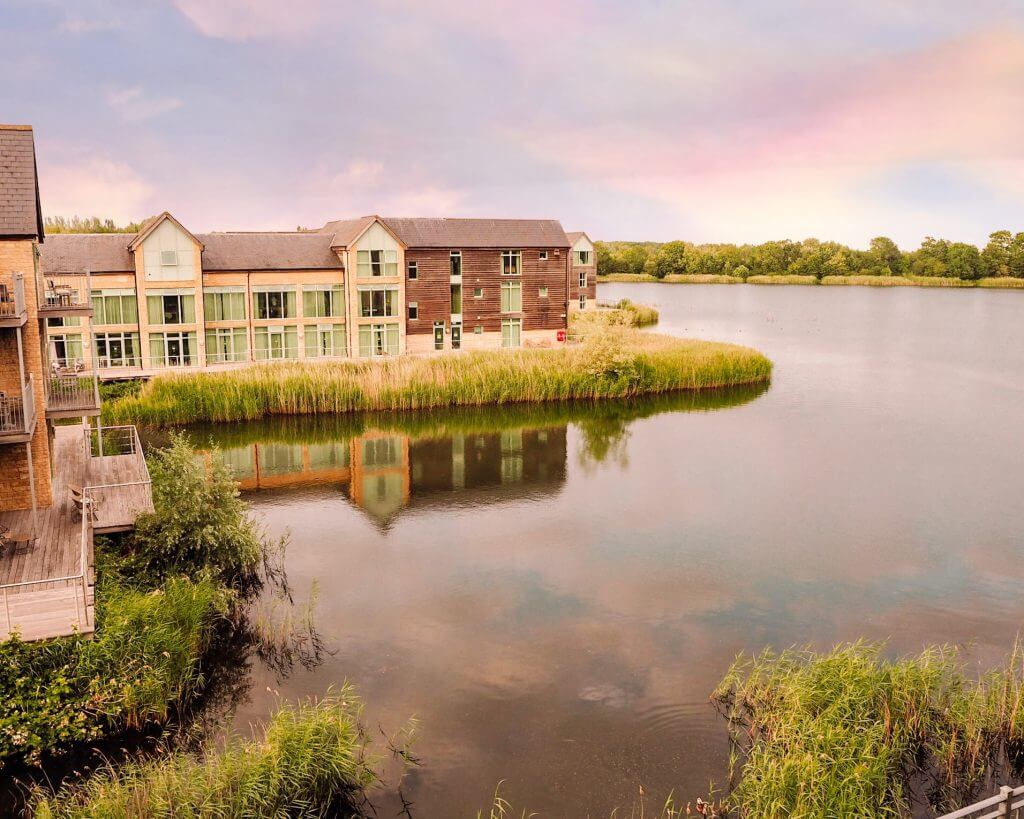 Sunset at the De Vere Cotswolds Water Park Hotel.Exterior of a luxury hotel nestled amidst the picturesque countryside of the Cotswolds.