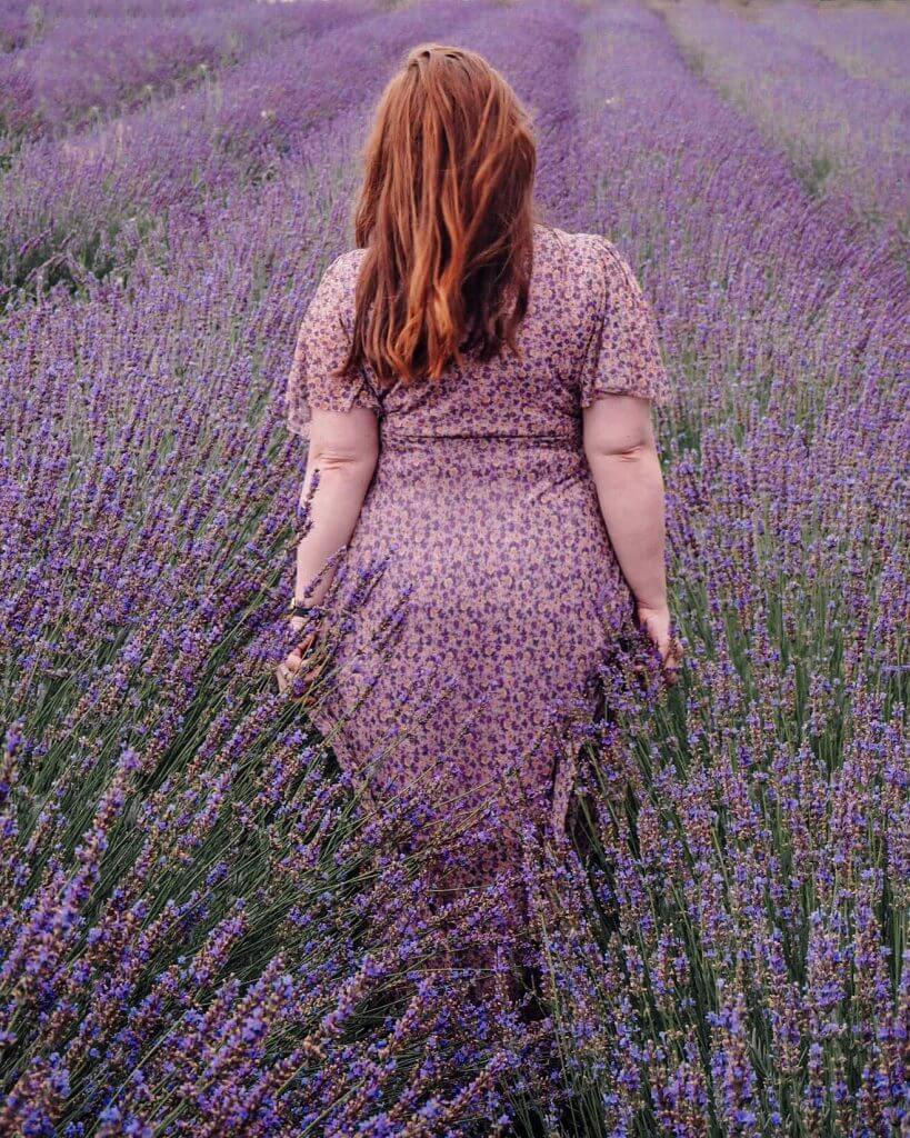 Woman standing in a lavender field in Romania