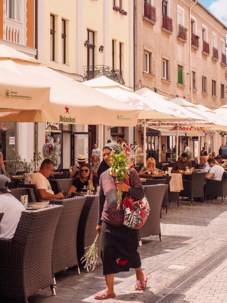 Romani gypsy selling flowers in Oradea Romania