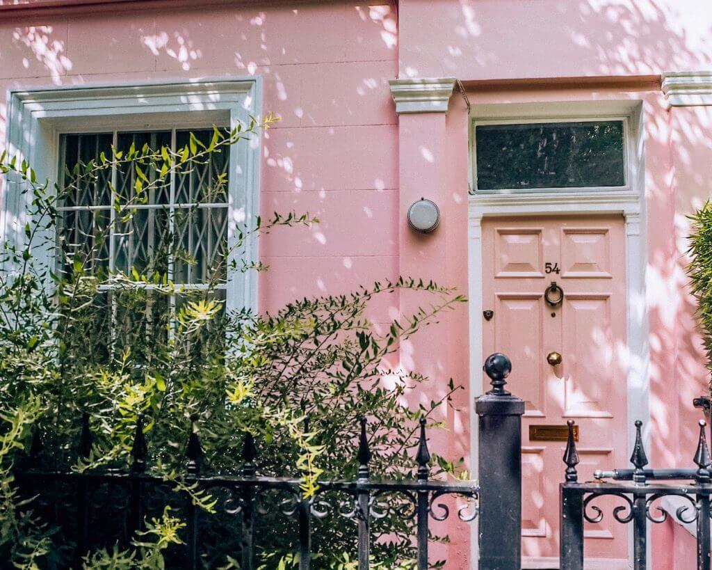 Pastel pink house at Number 54 Portobello Road. The pretty pastel houses of Notting Hill London.