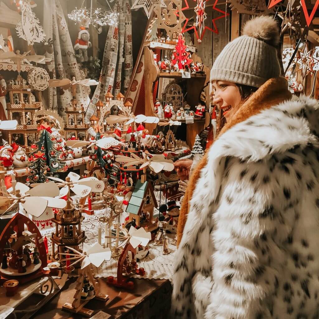 Woman shopping at the Christmas Markets in Colmar. 