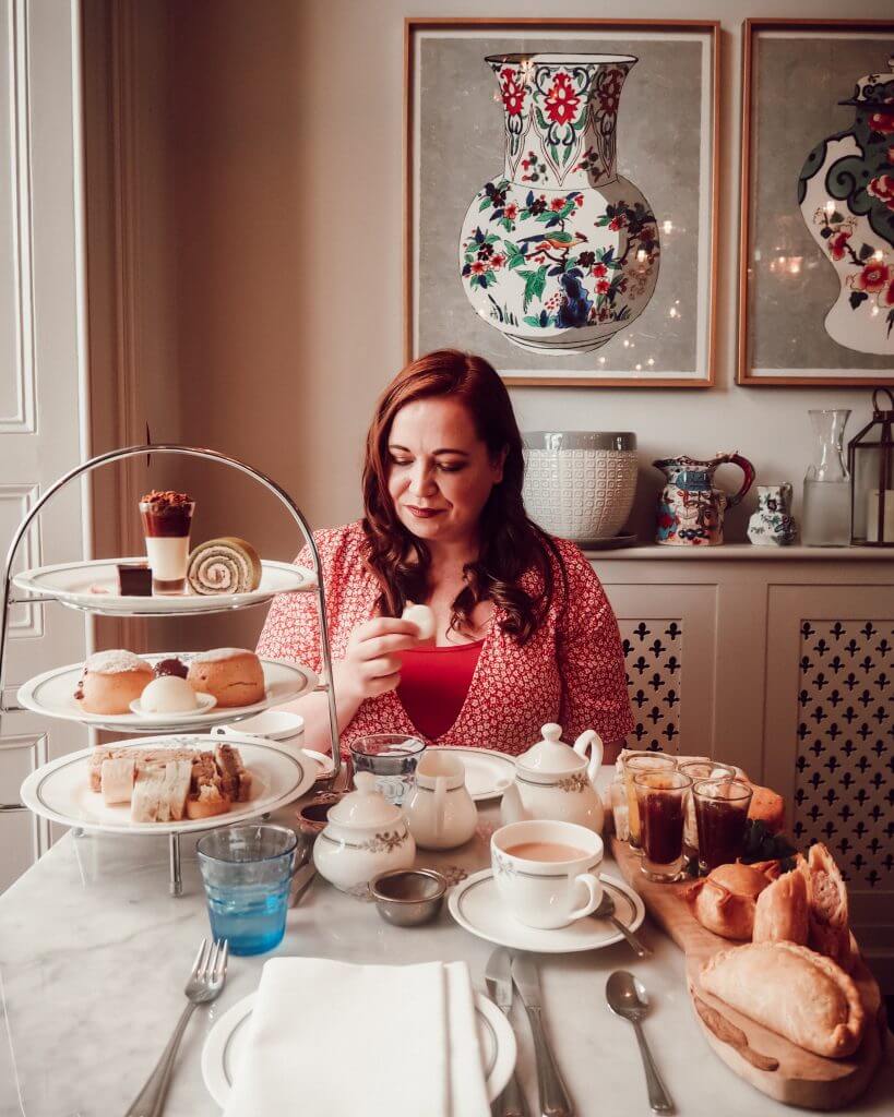 Woman in a red dress having Afternoon tea in Bath UK