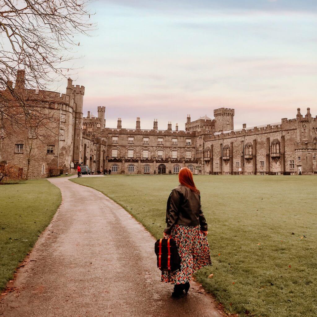 Girl standing in front of Kilkenny Castle