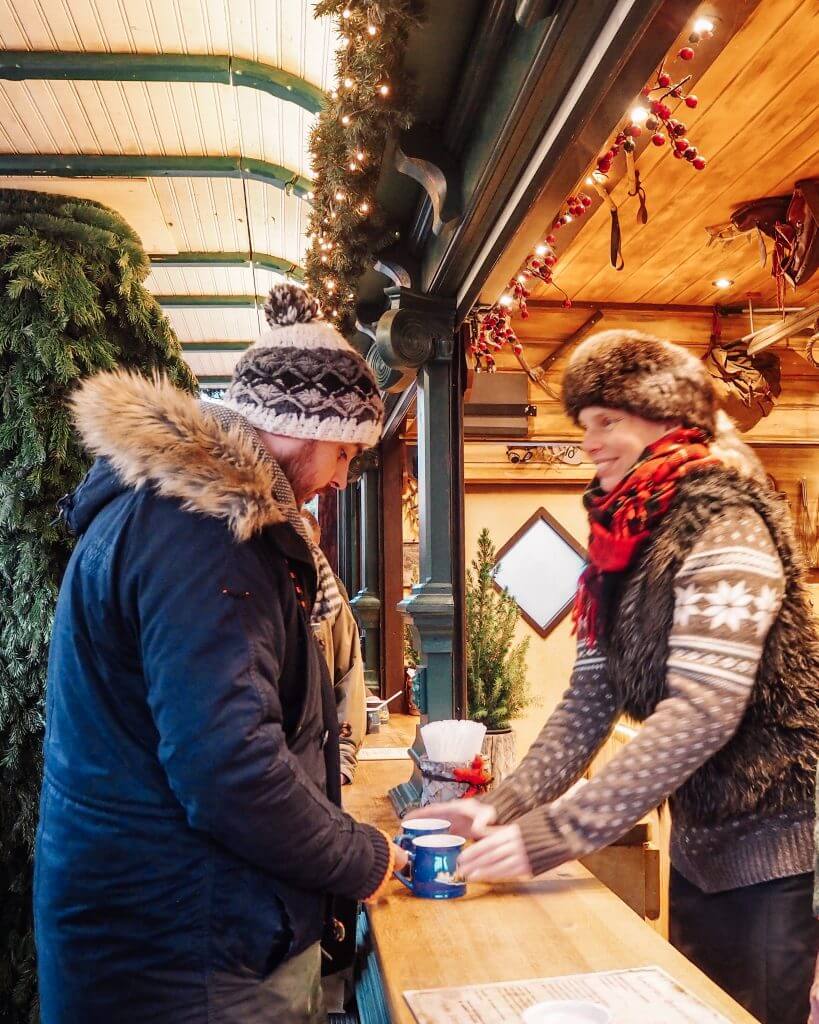 Buying mulled wine at the Hamburg Christmas Markets
