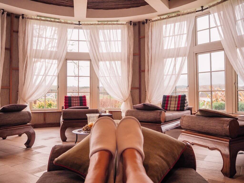 Woman's feet in slippers relaxing in the Sabai Sabai room at The Thai Spa in Lough Erne.