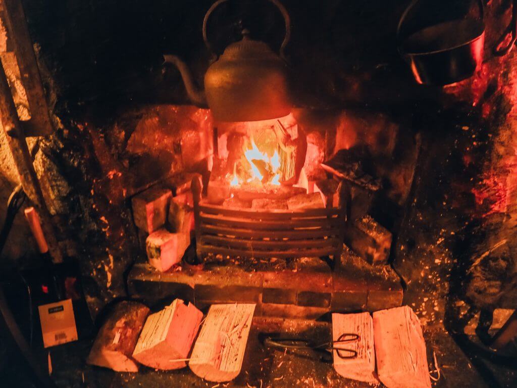 Kettle boiling over an open fire