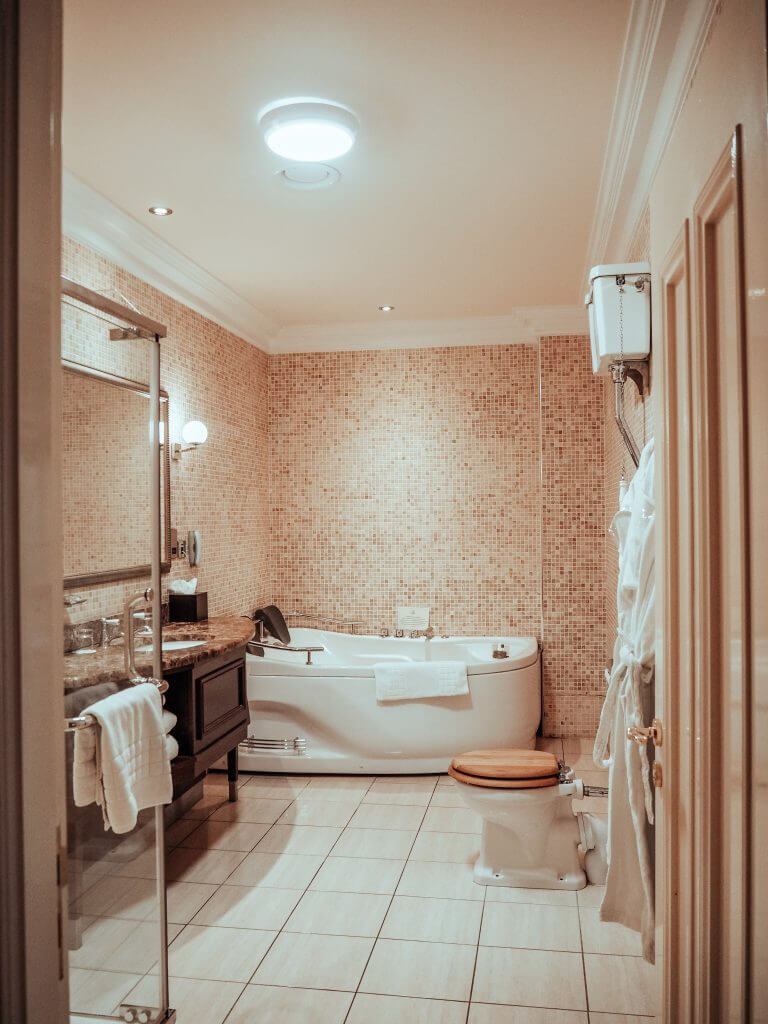 Bathroom of the Dovecote suite at Lough Erne Hotel with a double jacuzzi.
