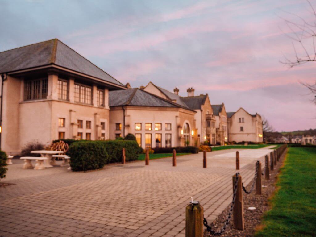 The buildings of Lough Erne Golf and Spa resort at sunset.