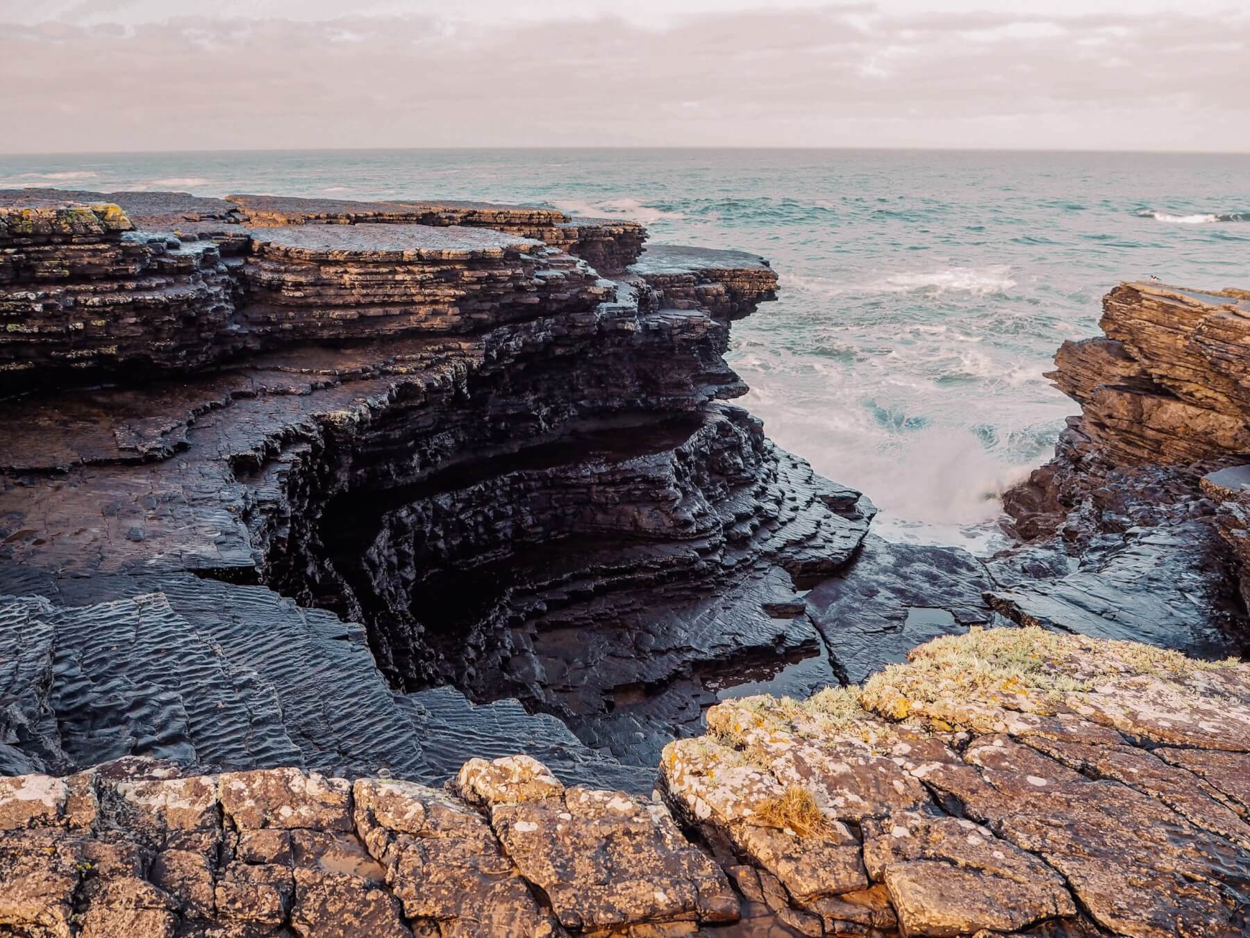 Unusual rock formations at Kilkee Cliffs in Ireland