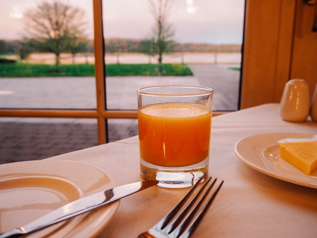 A glass of Orange Juice on a breakfast table