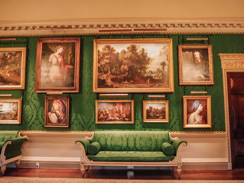 Oil paintings and a green couch at Hillsbourough Castle and Gardens
