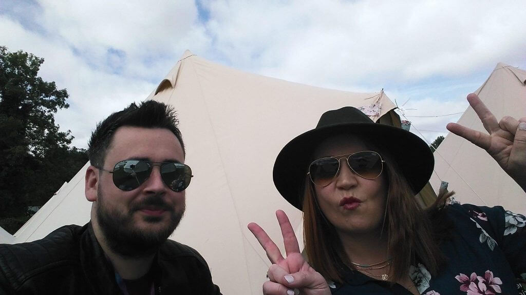 Couple at a music festival in Ireland listening to the best alternative love songs