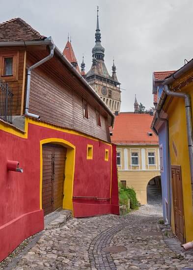 One of the best things to do in Sighisoara is simply wander its colourful streets. Alley in Sighisoara, world heritage site in Romania.