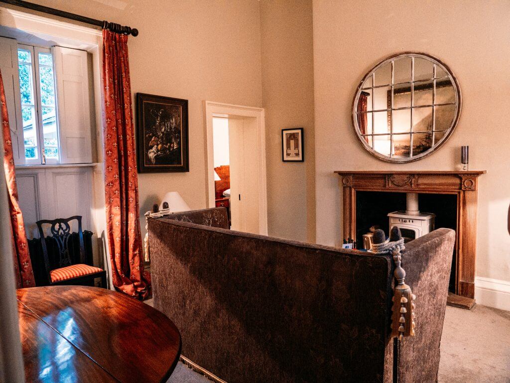 The interior sitting room with antiques at Loughcrew Lodge in Ireland a unique place to stay