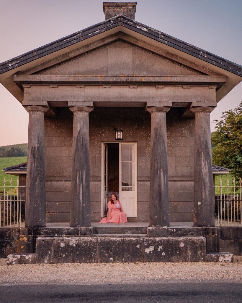 Woman sitting outside her bedroom at Loughcrew Lodge a unique place to stay in Ireland
