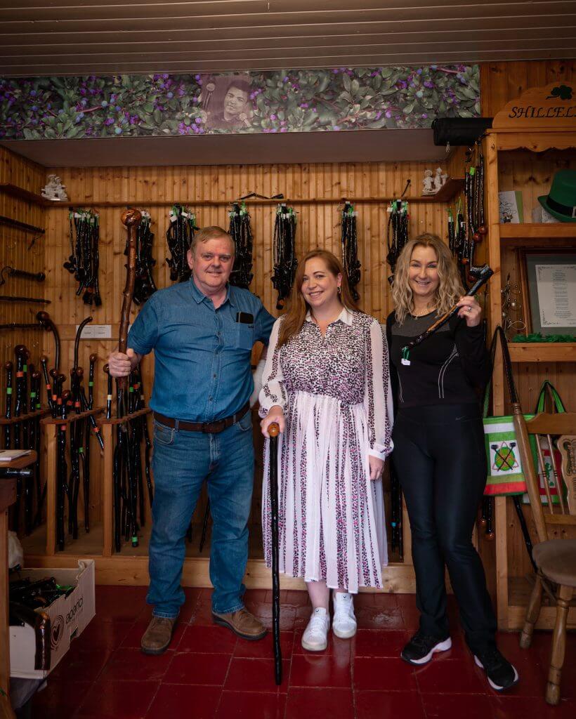 Woman meeting the owners of the Olde Shillelagh Stick Maker Shop in Wicklow Ireland