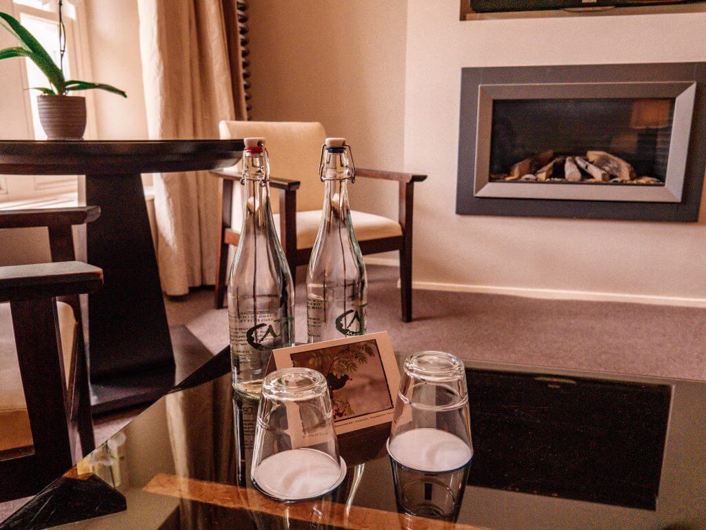 Bottles of water on a desk in a hotel room in Ireland, where to stay in Ireland