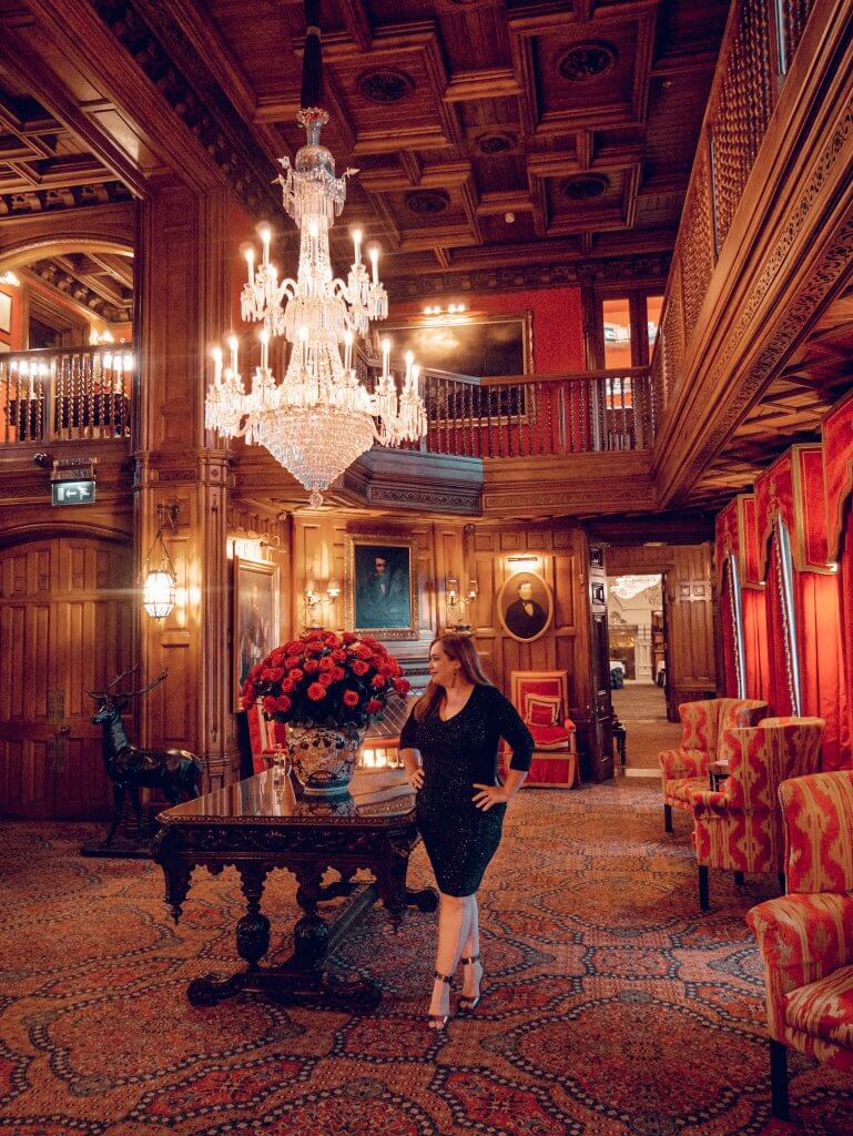 Luxury hotels Ireland, woman standing in the Oak Hall in Ashford Castle in Ireland