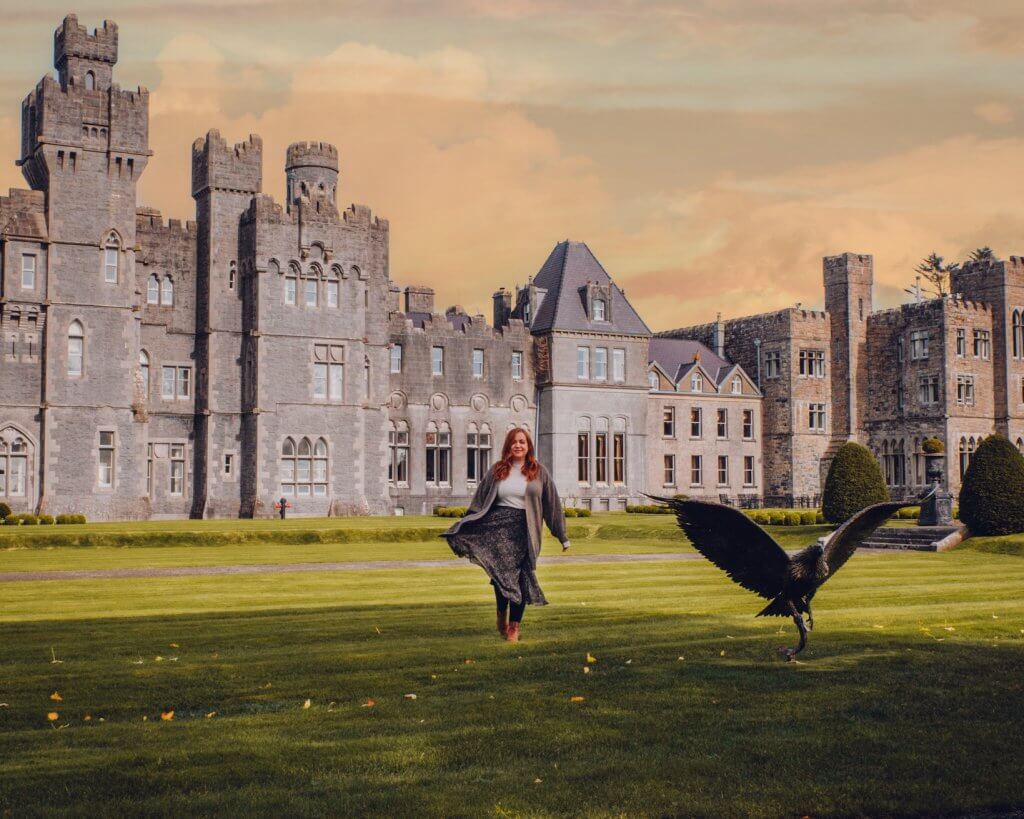 Luxury hotels Ireland, woman walking on the grounds of Ashford Castle Hotel
