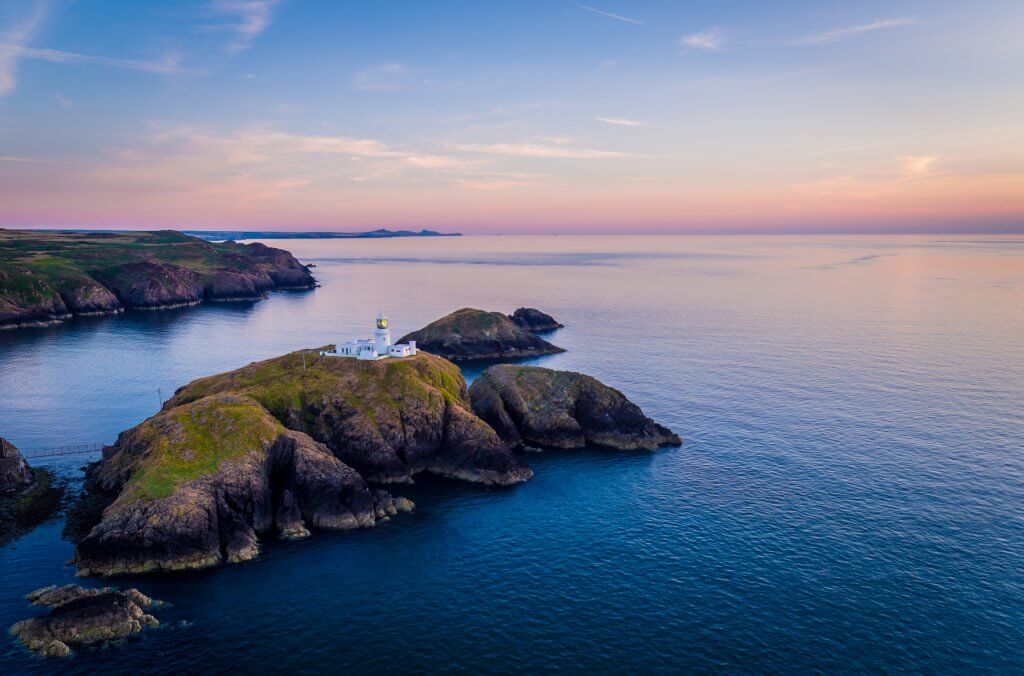 Strumble Head Lighthouse at sunset on the Pembrokeshire coast part of the Celtic routes of Wales