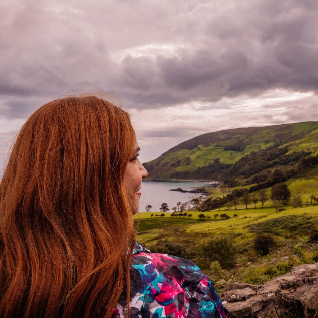 Over the shoulder shot of Murlough Bay in County Antrim Northern Ireland