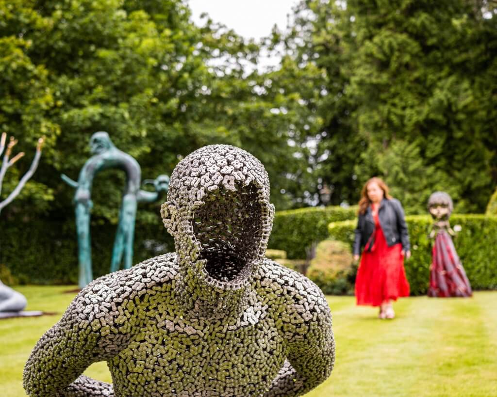 Woman exploring the art and soul international art fair at Culloden Estate and Spa