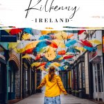 Woman looking at an umbrella sky with text overlay how to spend the best weekend in Kilkenny Ireland