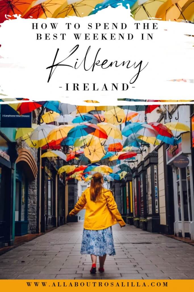 Woman looking at an umbrella sky with text overlay how to spend the best weekend in Kilkenny Ireland
