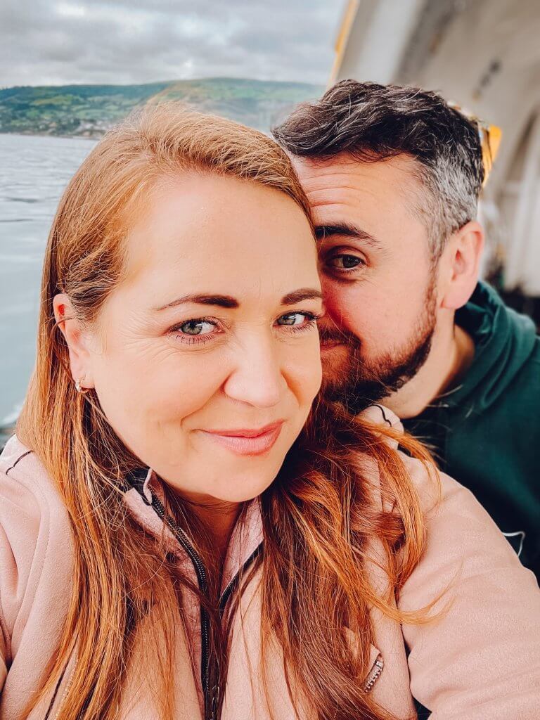 Couple on a boat at Carnlough Harbour Antrim