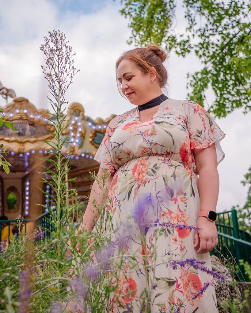 Woman in a floral dress at one of the best instagram spots in Bordeaux, jardin public