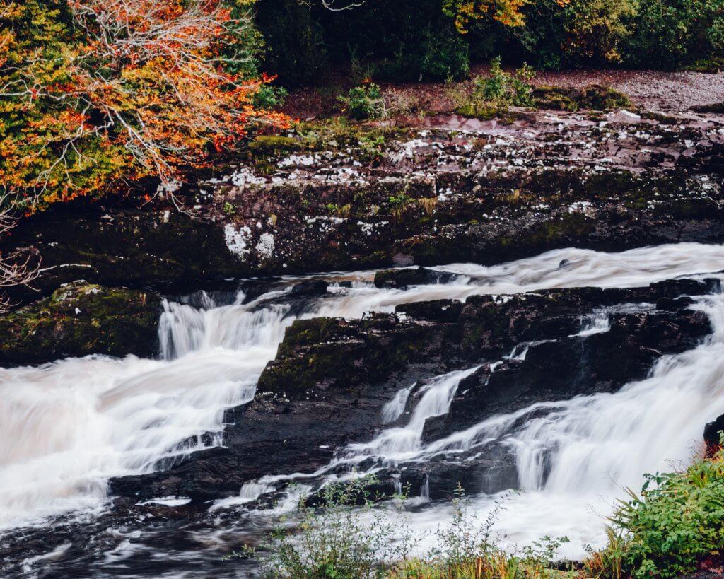 Water cascading at Sheen Falls waterfall in Kenmare Ireland.