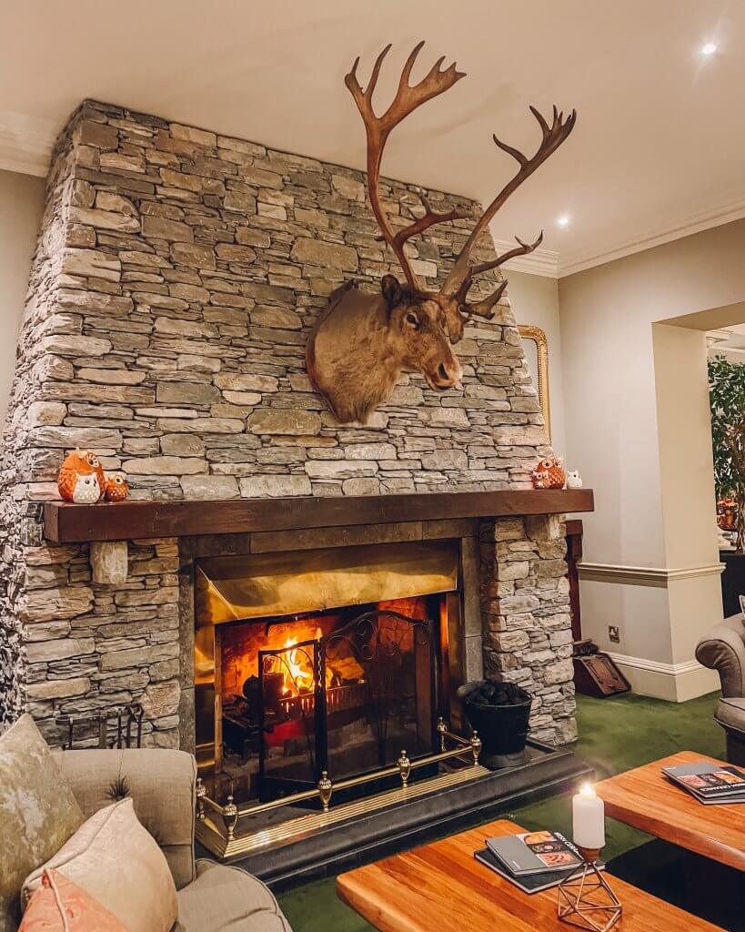 Stag head over fireplace in Sheen Falls Lodge a luxury 5 star hotel in Ireland