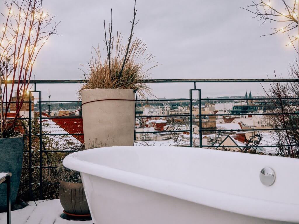 Freestanding bath on an outdoor terrace at the Penthouse suite at Mosaic House Design Hotel