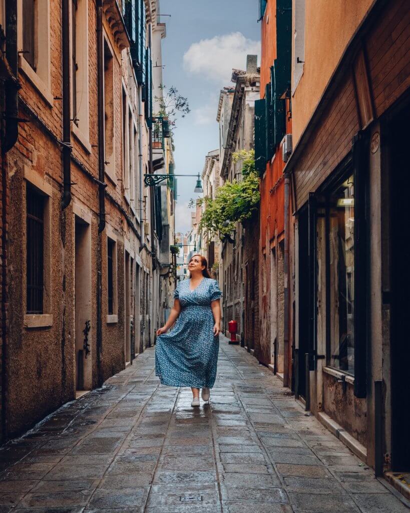 Woman walking along the streets of Cannaregio Venice