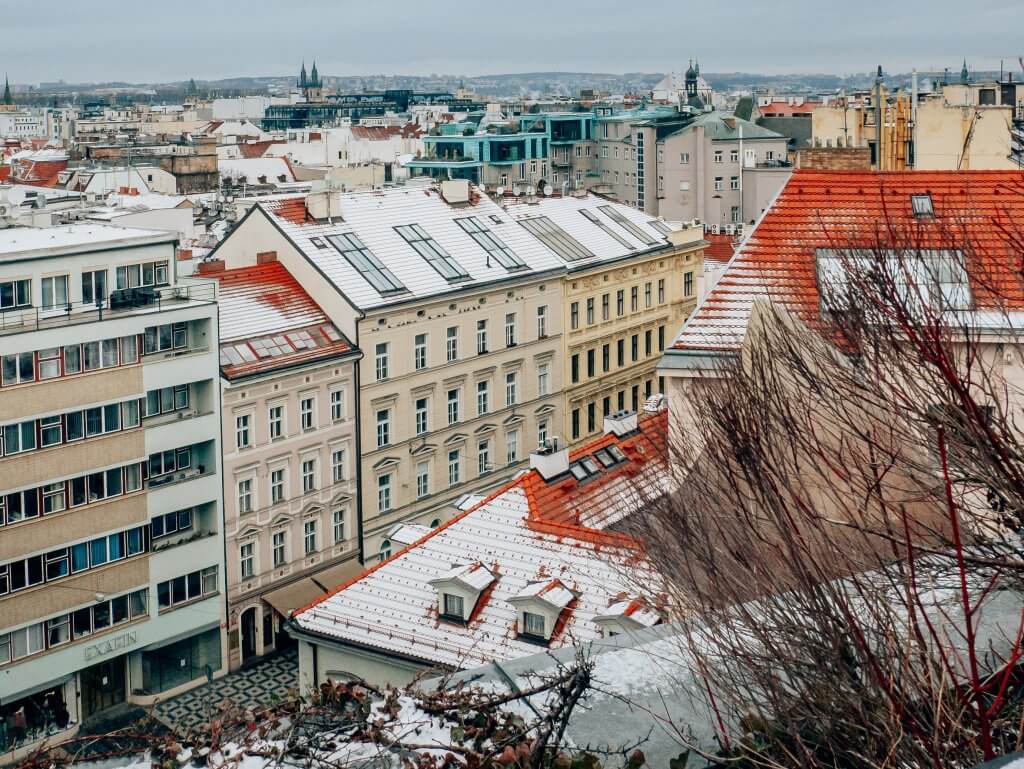 Snowy rooftop views of Prague