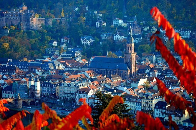 Heidelberg in autumn, showcasing vibrant foliage and a charming atmosphere.