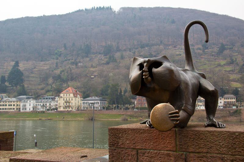 The famous Brückenaffe (Bridge Monkey) statue at the entrance to the Old Bridge in Heidelberg.