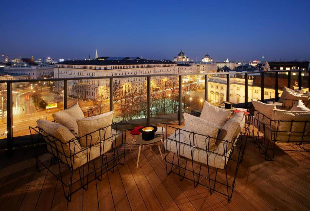 Rooftop bar with views of Vienna at night at 25hours Hotel Museum Quarter.