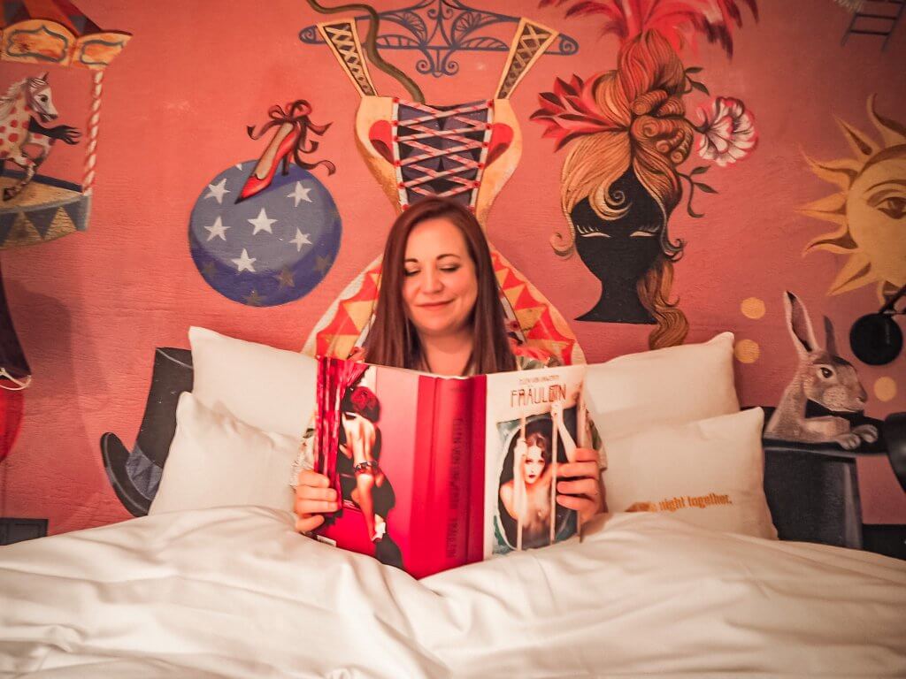 Woman reading a book in a circus theme room in 25 hours hotel Vienna Austria the perfect place to stay for 3 days in Vienna