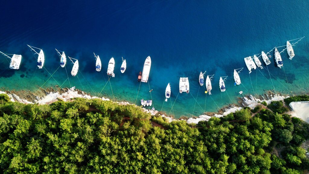 Aerial view of boats in the harbour at Fiskardo Kefalonia